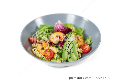 Plate with appetizing pasta in vegetables and with seafood. Plate with appetizing pasta in vegetables and with seafood. 77741309