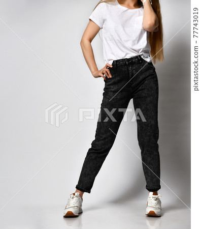 slim female figure in black fashionable jeans slim female figure in black fashionable jeans 77743019