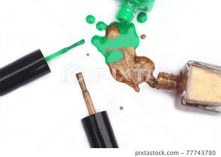 Green and Gold Nail polish Spilled 77743780