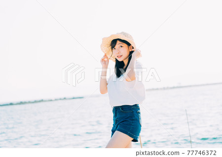 Sea and young woman Sea and young woman 77746372