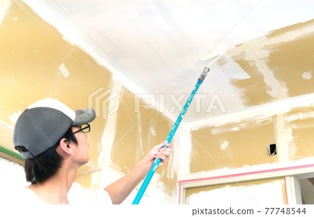 A painter who works at a construction site 77748544