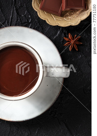 Hot chocolate close-up on a black background 77751180