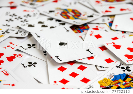 Classic playing card game laid out on a table 77752113
