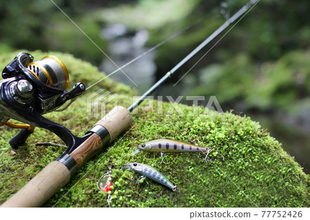 Mountain stream lure fishing and clear stream green image Mountain stream lure fishing and clear stream green image 77752426