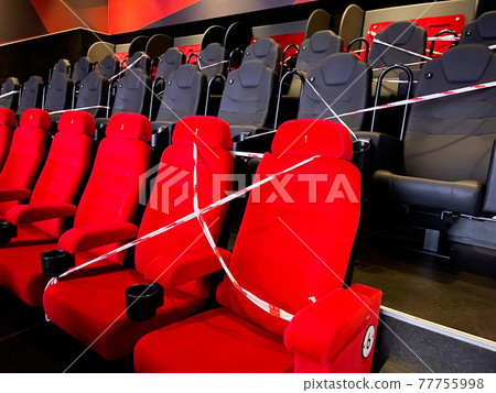 Alternative seating marks for social distancing at the cinema . 77755998