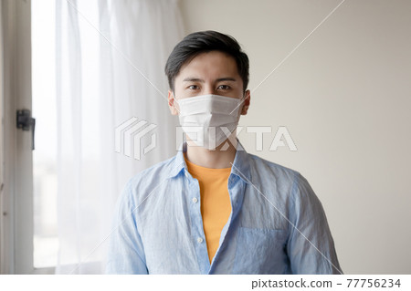 asian man is self quarantine 77756234