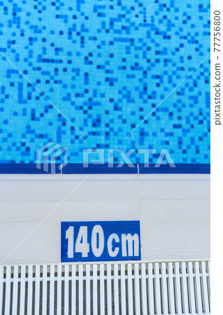 Vertical photo of pool edge with 140cm text on it. Safety in pool. Swimming training and exercises 77756800