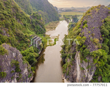 the majestic scenery on Ngo Dong river in Tam Coc Bich Dong view from drone in Ninh Binh province of Viet Nam the majestic scenery on Ngo Dong river in Tam Coc Bich Dong view from drone in Ninh Binh province of Viet Nam 77757011