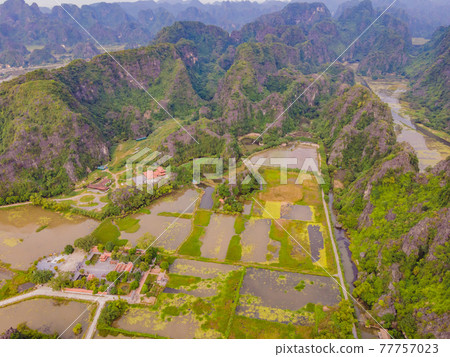 the majestic scenery on Ngo Dong river in Tam Coc Bich Dong view from drone in Ninh Binh province of Viet Nam the majestic scenery on Ngo Dong river in Tam Coc Bich Dong view from drone in Ninh Binh province of Viet Nam 77757023