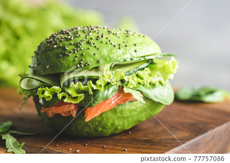 Avocado burger with salmon. Avocado burger with salmon. 77757086