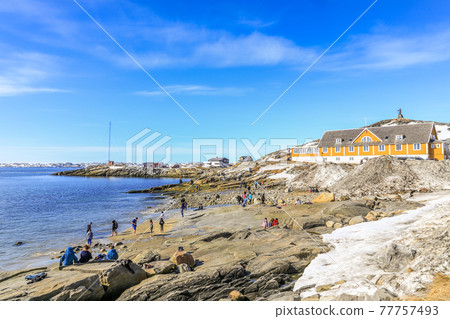 Beach time for Inuit people enjoying the sunny May day at the sea fjord, Nuuk city, Greenland Beach time for Inuit people enjoying the sunny May day at the sea fjord, Nuuk city, Greenland 77757493
