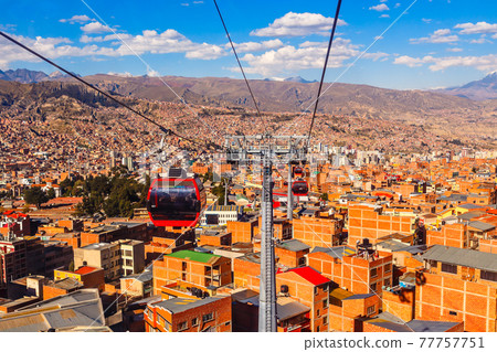 Cable cars or funicular system over orange roofs and buildings of the Bolivian capital, La Paz, Bolivia Cable cars or funicular system over orange roofs and buildings of the Bolivian capital, La Paz, Bolivia 77757751