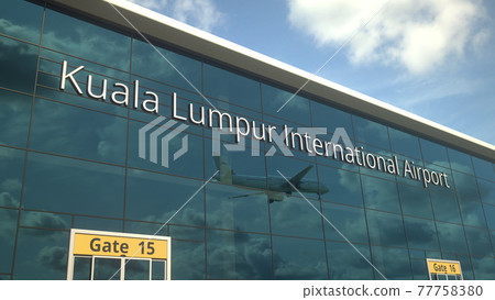 Landing airplane reflects in the modern windows with Kuala Lumpur International Airport text. 3d rendering 77758380