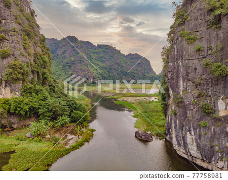 the majestic scenery on Ngo Dong river in Tam Coc Bich Dong view from drone in Ninh Binh province of Viet Nam 77758981