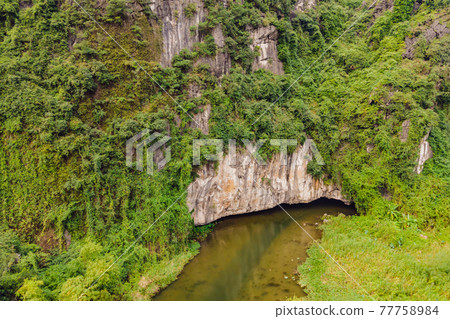 the majestic scenery on Ngo Dong river in Tam Coc Bich Dong view from drone in Ninh Binh province of Viet Nam 77758984