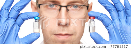Male person in blue glove hold vaccine bottles. Injection drug pharmacy concept Male person in blue glove hold vaccine bottles. Injection drug pharmacy concept 77761317