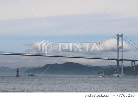 Lighthouse and ship in the haze and Kurushima Kaikyo Bridge Lighthouse and ship in the haze and Kurushima Kaikyo Bridge 77763256