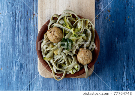spelt tagliatelle with vegan meatballs and kale 77764748