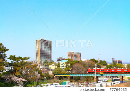 Scenery of cherry blossoms and Meitetsu train around Okazaki Castle Scenery of cherry blossoms and Meitetsu train around Okazaki Castle 77764985