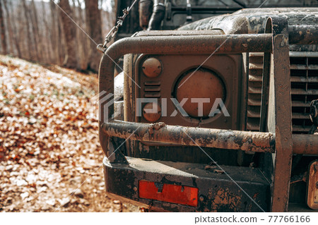 Closeup photo of off road car in mountains 77766166
