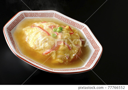 Hot bean paste Chinese style omelet rice, Tianjin rice shot on a black background Hot bean paste Chinese style omelet rice, Tianjin rice shot on a black background 77766552