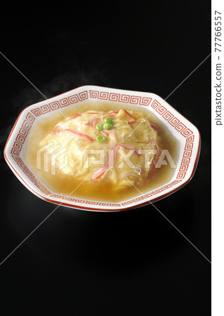 Hot bean paste Chinese style omelet rice, Tianjin rice shot on a black background Hot bean paste Chinese style omelet rice, Tianjin rice shot on a black background 77766557