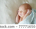 Adorable baby sleeping on bed at home 77771650