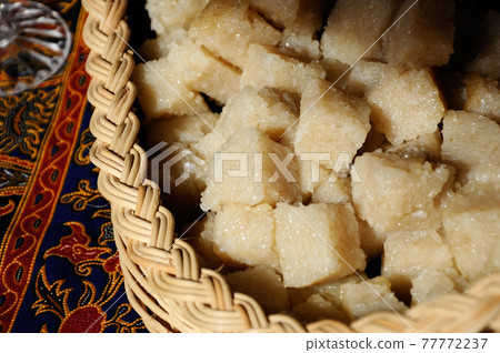 Glutinous rice or locally called pulut impit cook and steam and the press in a container. It was then cut into cubes before serving. Malay traditional food. Glutinous rice or locally called pulut impit cook and steam and the press in a container. It was then cut into cubes before serving. Malay traditional food. 77772237