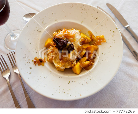 Huevos rotos con morcilla, scrambled eggs with blood sausage Huevos rotos con morcilla, scrambled eggs with blood sausage 77772269