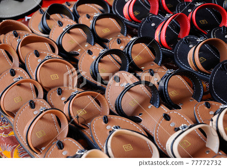 SEREMBAN, MALAYSIA -APRIL 15, 2017: Malay traditional sandals for men. It is handcrafted using animal skins. SEREMBAN, MALAYSIA -APRIL 15, 2017: Malay traditional sandals for men. It is handcrafted using animal skins. 77772732