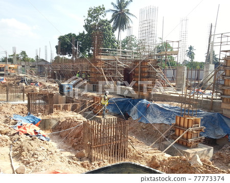 JOHOR, MALAYSIA -MARCH 29, 2016: Construction workers spraying the anti termite chemical treatment to the soil at the construction site.  77773374