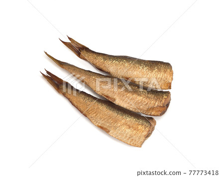 Smoked european sprats isolated on a white Smoked european sprats isolated on a white 77773418