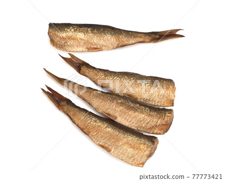 Smoked european sprats isolated on a white Smoked european sprats isolated on a white 77773421