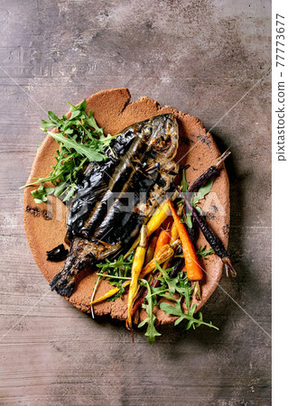 Grilled cooked fresh gutted sea bream or dorado fish 77773677