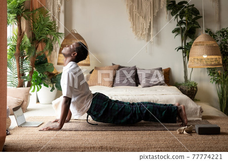 man working out, yoga, pilates, fitness training, exercises for flexible spine, urdhva mukha shvanasana 77774221