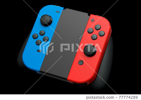 Portable video game controllers attached to touch screen on black background 77774289