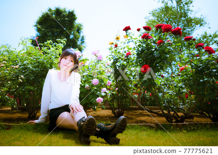 A cute woman and a red rose and a pink rose at a rose spot A cute woman and a red rose and a pink rose at a rose spot 77775621