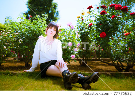 A cute woman and a red rose and a pink rose at a rose spot A cute woman and a red rose and a pink rose at a rose spot 77775622