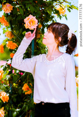 Orange roses and cute girls 77777176