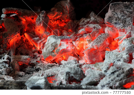 burning red coals of a fire burning red coals of a fire 77777580