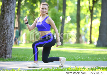 cute young athletic girl doing sports in nature 77778153