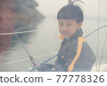 A moment on a yacht for a 5-year-old child 77778326