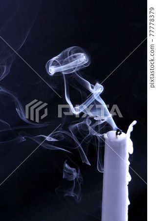 whimsical shape of the smoke of an extinguished candle whimsical shape of the smoke of an extinguished candle 77778379