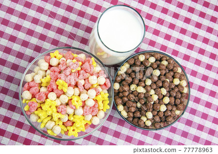 Colored light snacks. Breakfast in a plate and a glass of milk. Diet and calories. Dessert food. Colored light snacks. Breakfast in a plate and a glass of milk. Diet and calories. Dessert food. 77778963