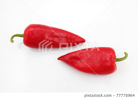 two bright red sweet peppers on a white background two bright red sweet peppers on a white background 77778964