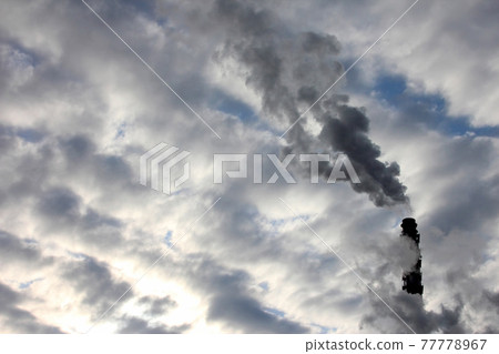 the smoke from the chimney of an industrial enterprise in the sky. the smoke from the chimney of an industrial enterprise in the sky. 77778967