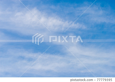 Contrails passing through altocumulus Contrails passing through altocumulus 77779395