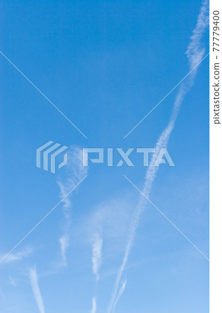 Air show traces, blue sky and straight clouds Air show traces, blue sky and straight clouds 77779400
