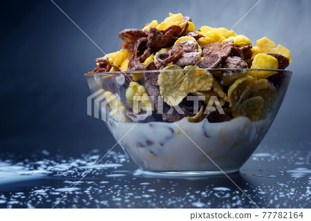 bowl of cornflakes filled with milk bowl of cornflakes filled with milk 77782164
