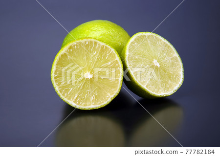 Citrus fruits. cut in half lemons on a gray background 77782184